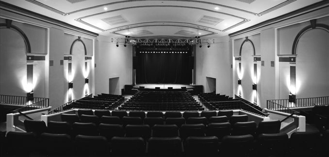 Black and white photo showing the inside of The Newton Theatre.