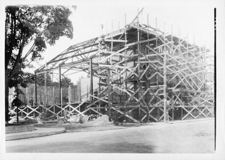 Historic photo showing brickwork being done to The Newton Theatre.