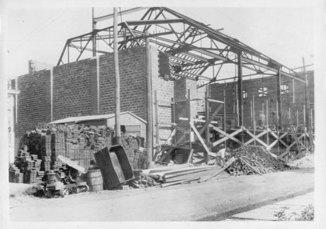 Historic photo showing construction of the back of The Newton Theatre.