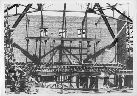 Historic photo showing the construction of the balcony of The Newton Theatre.
